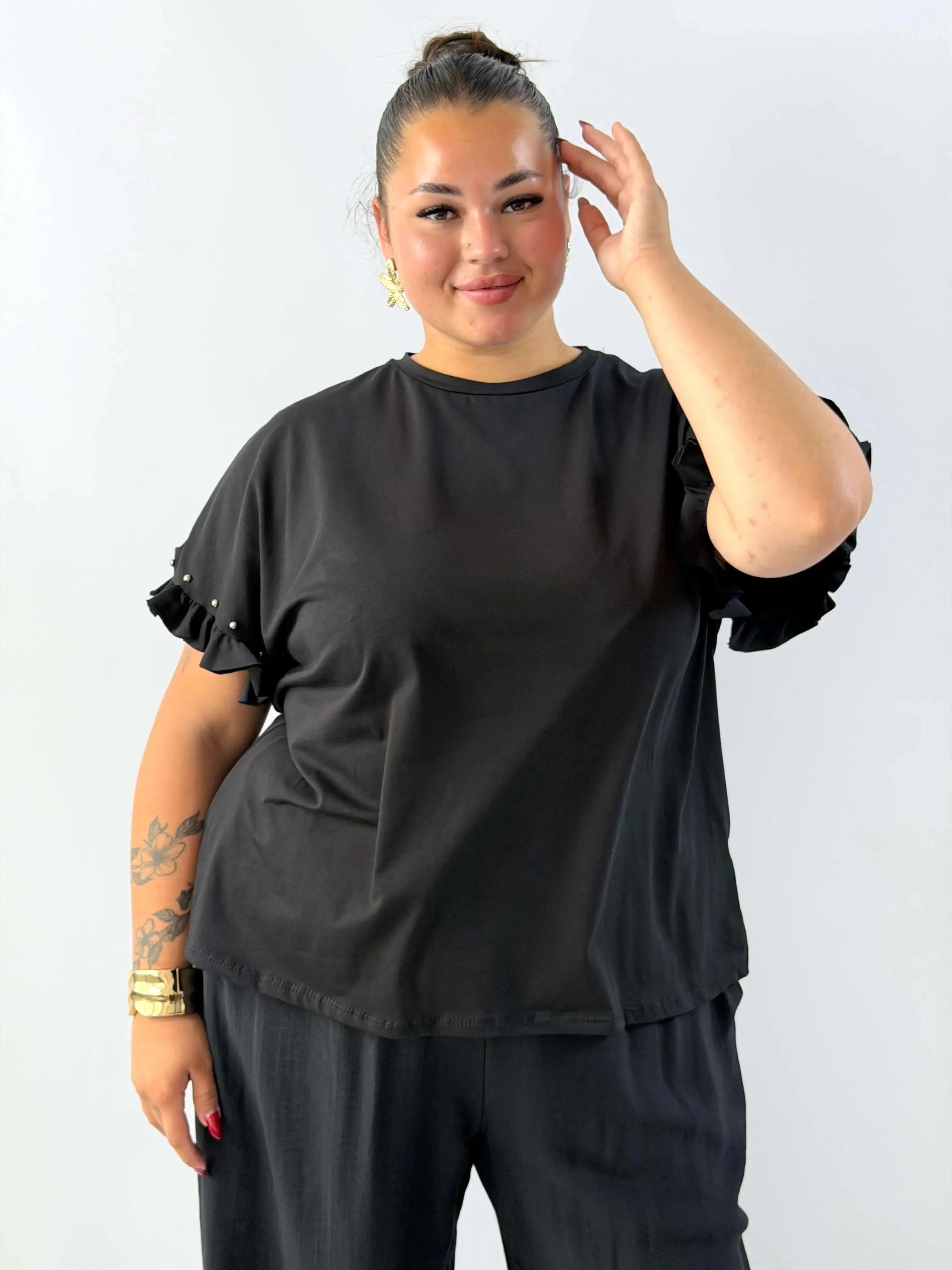 Bluzka damska z falbankami na rękawach – elegancka i wygodna na każdą okazję Stylowa XL