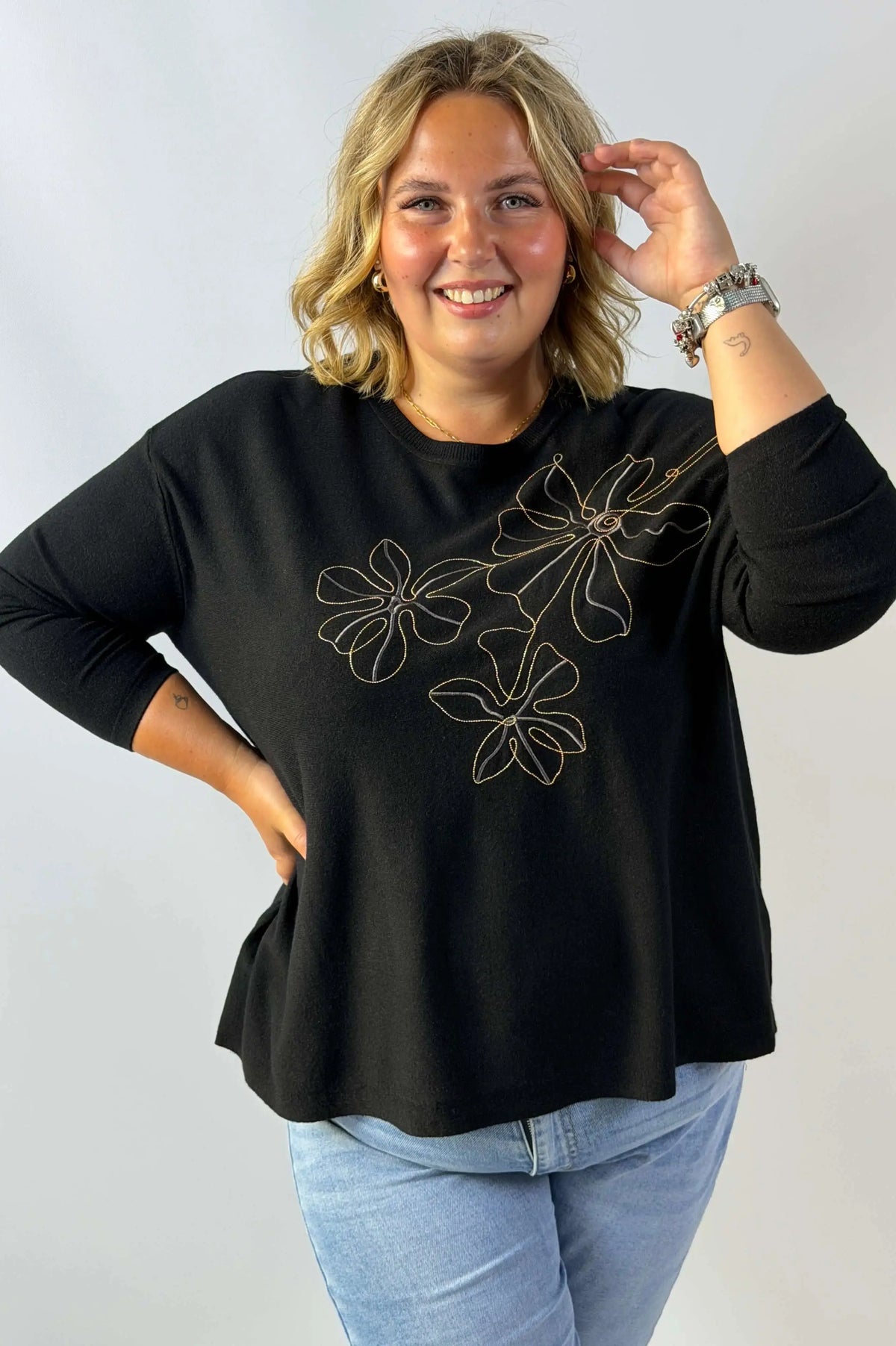 Bluzka sweterkowa Plus Size z efektownym haftem kwiatowym Stylowa XL