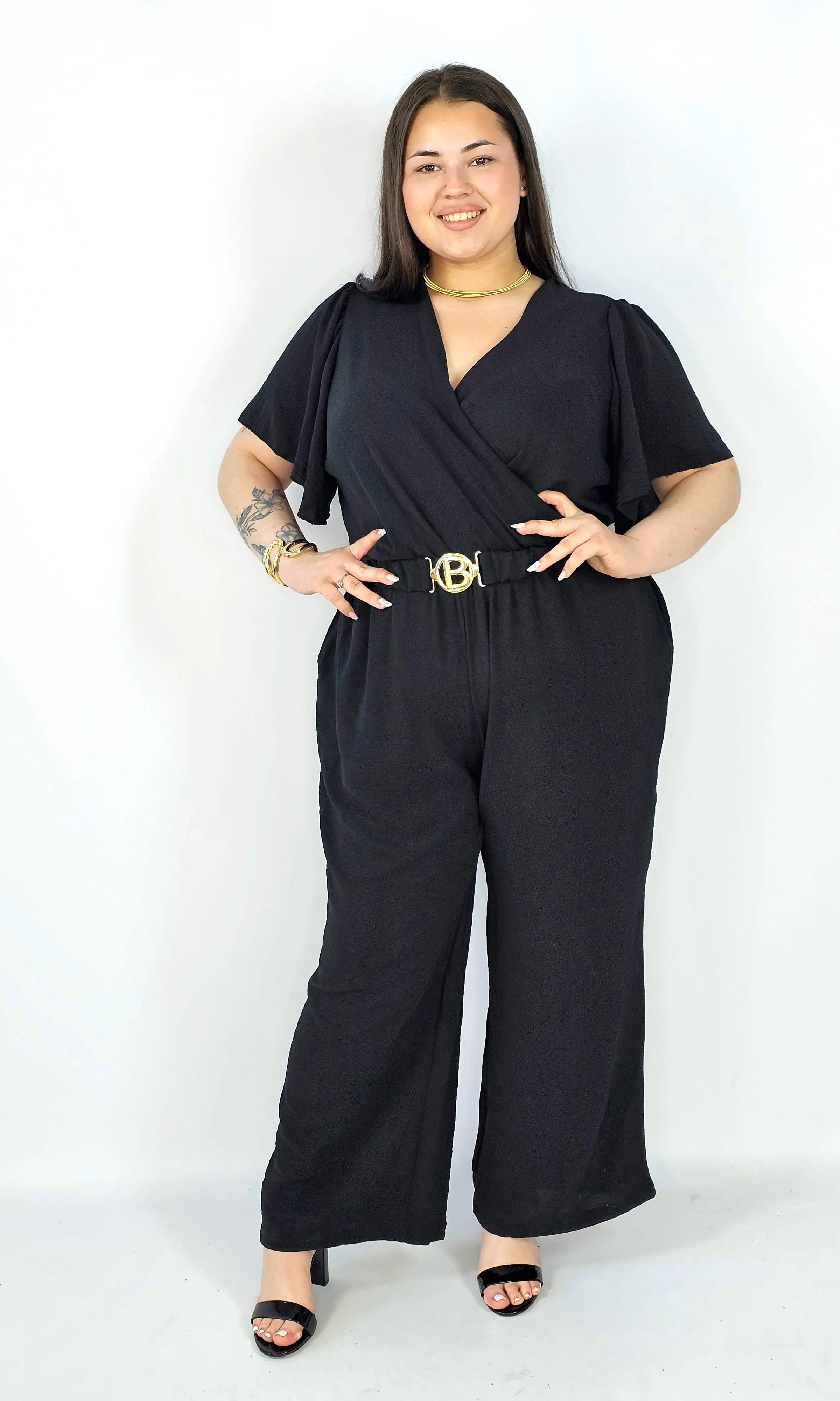 Kombinezon plus size z kopertowym dekoltem i paskiem – wygoda i styl XXL Stylowa XL