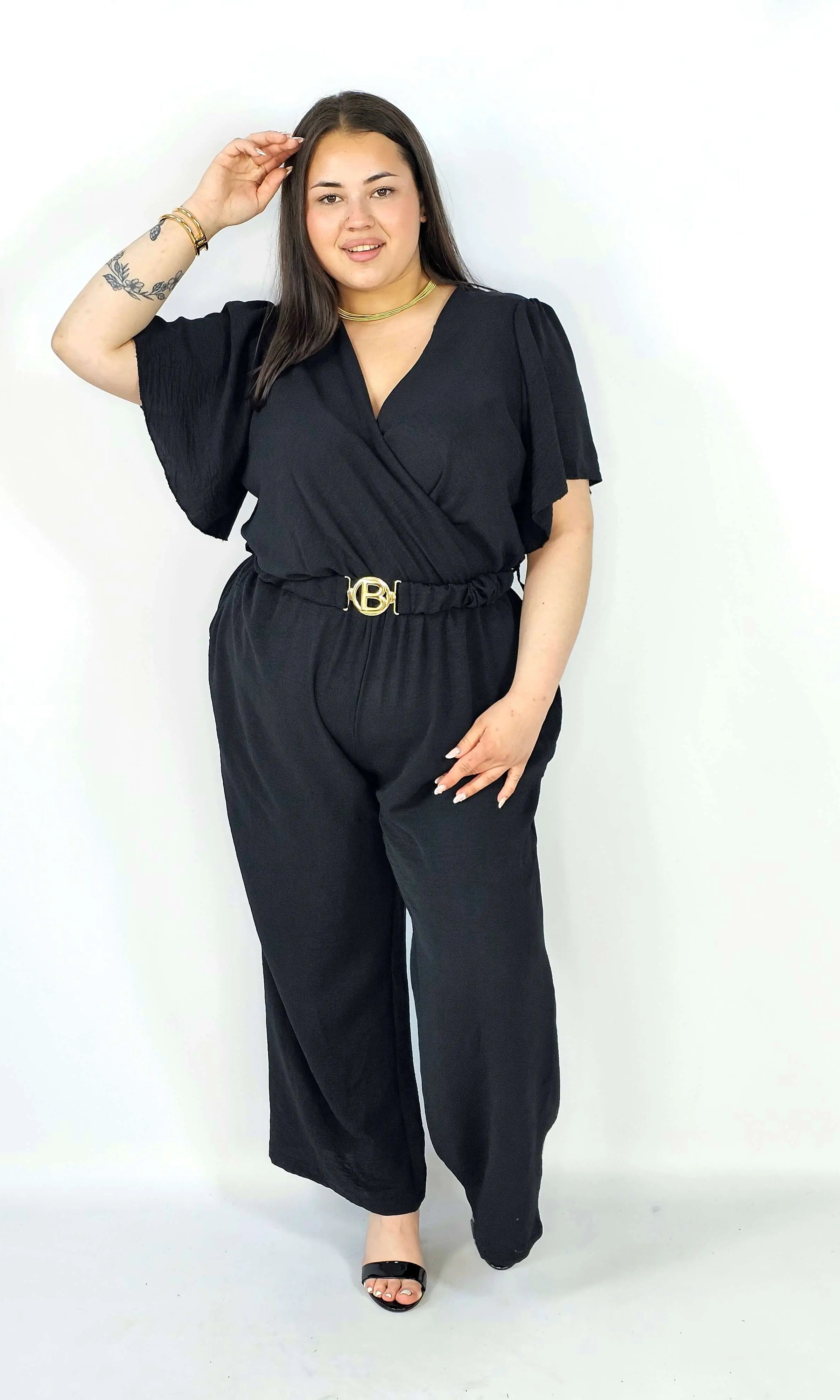 Kombinezon plus size z kopertowym dekoltem i paskiem – wygoda i styl XXL Stylowa XL