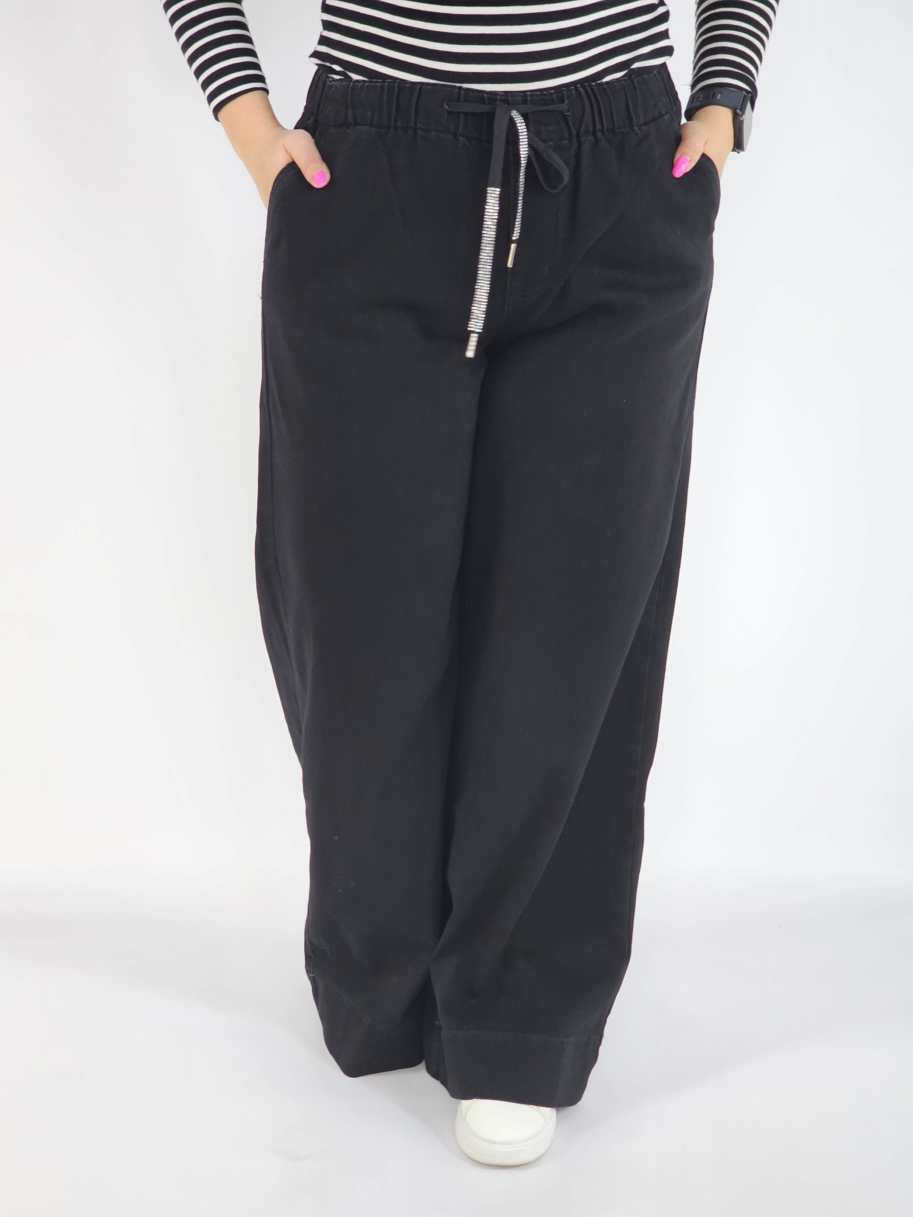 Spodnie jeans plus size – czarne szerokie spodnie z wiązaniem Stylowa XL