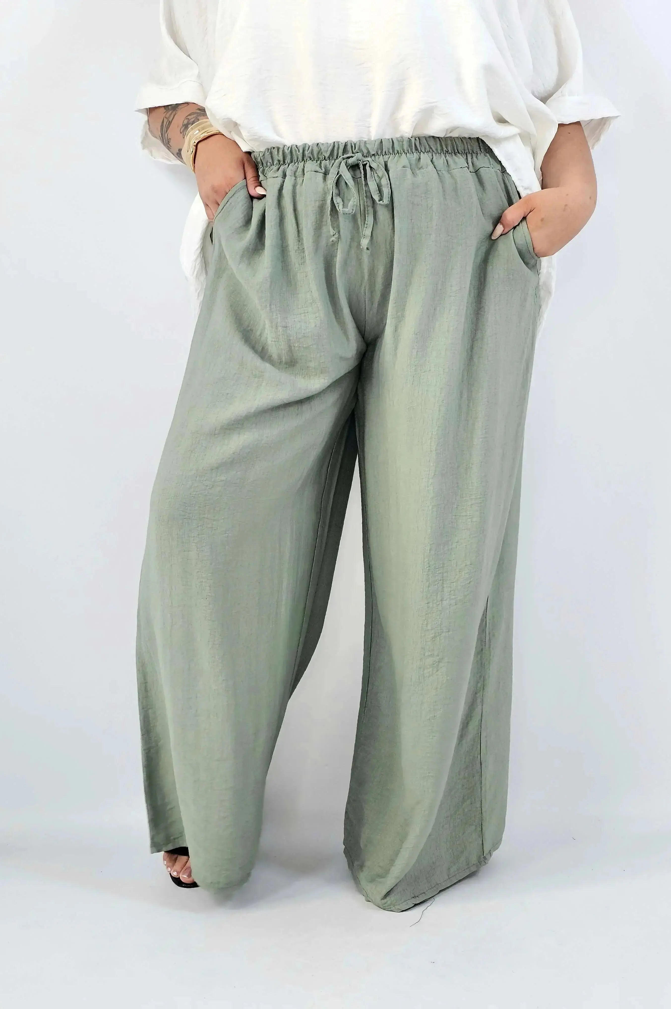 Spodnie wiskozowe plus size XXL – szerokie spodnie damskie z kieszeniami Stylowa XL