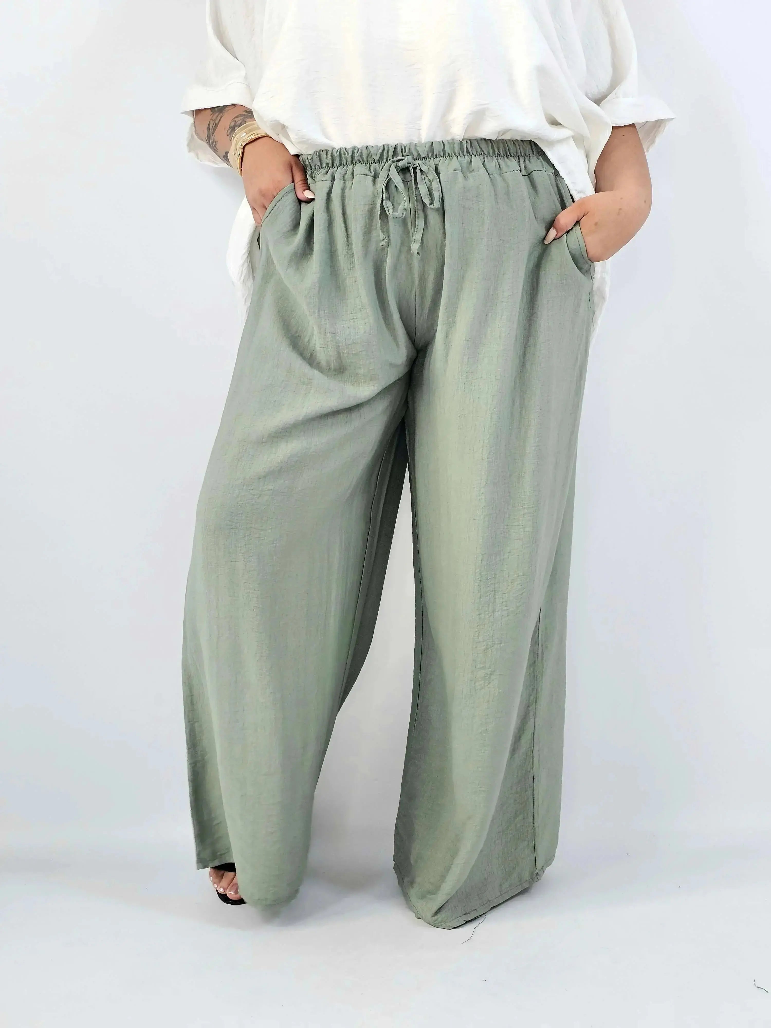Spodnie wiskozowe plus size XXL – szerokie spodnie damskie z kieszeniami Stylowa XL