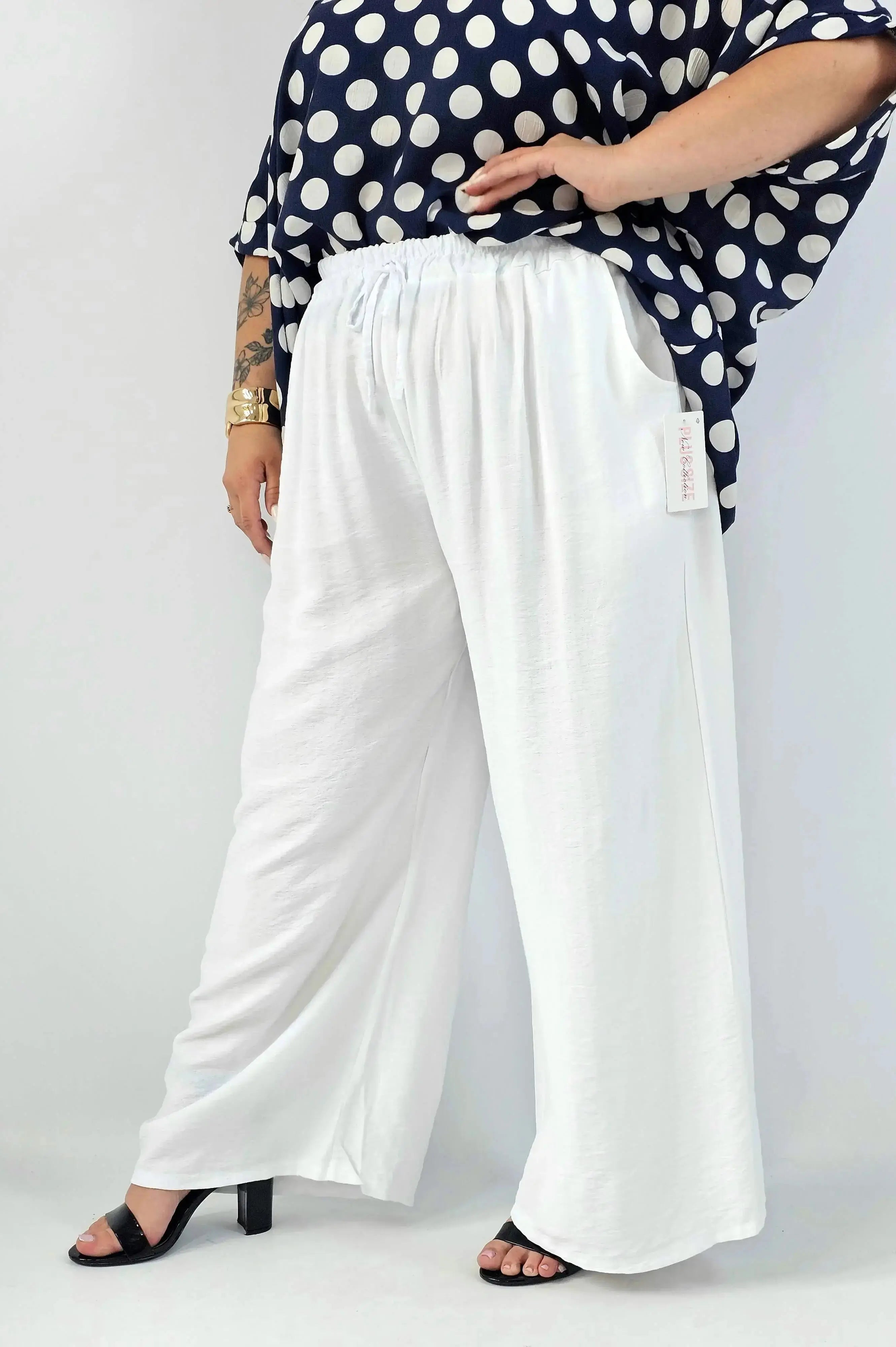 Spodnie wiskozowe plus size XXL – szerokie spodnie damskie z kieszeniami Stylowa XL