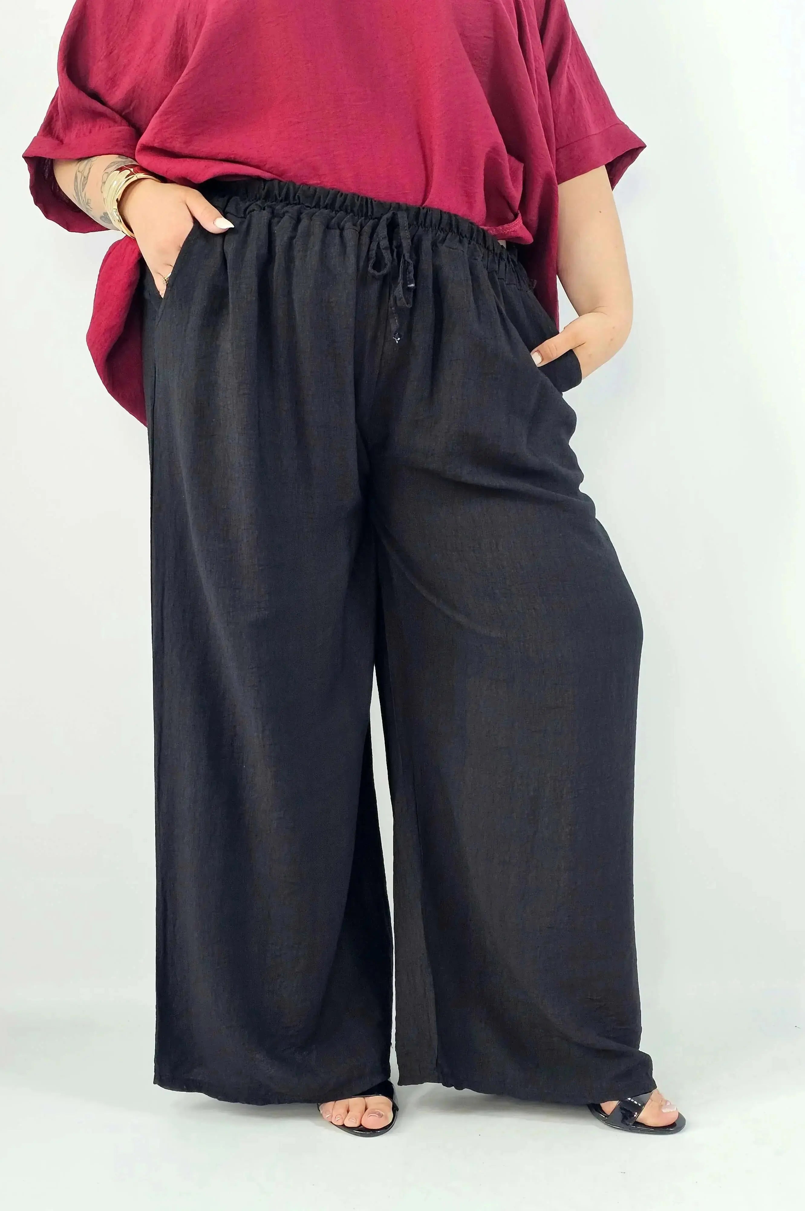 Spodnie wiskozowe plus size XXL – szerokie spodnie damskie z kieszeniami Stylowa XL