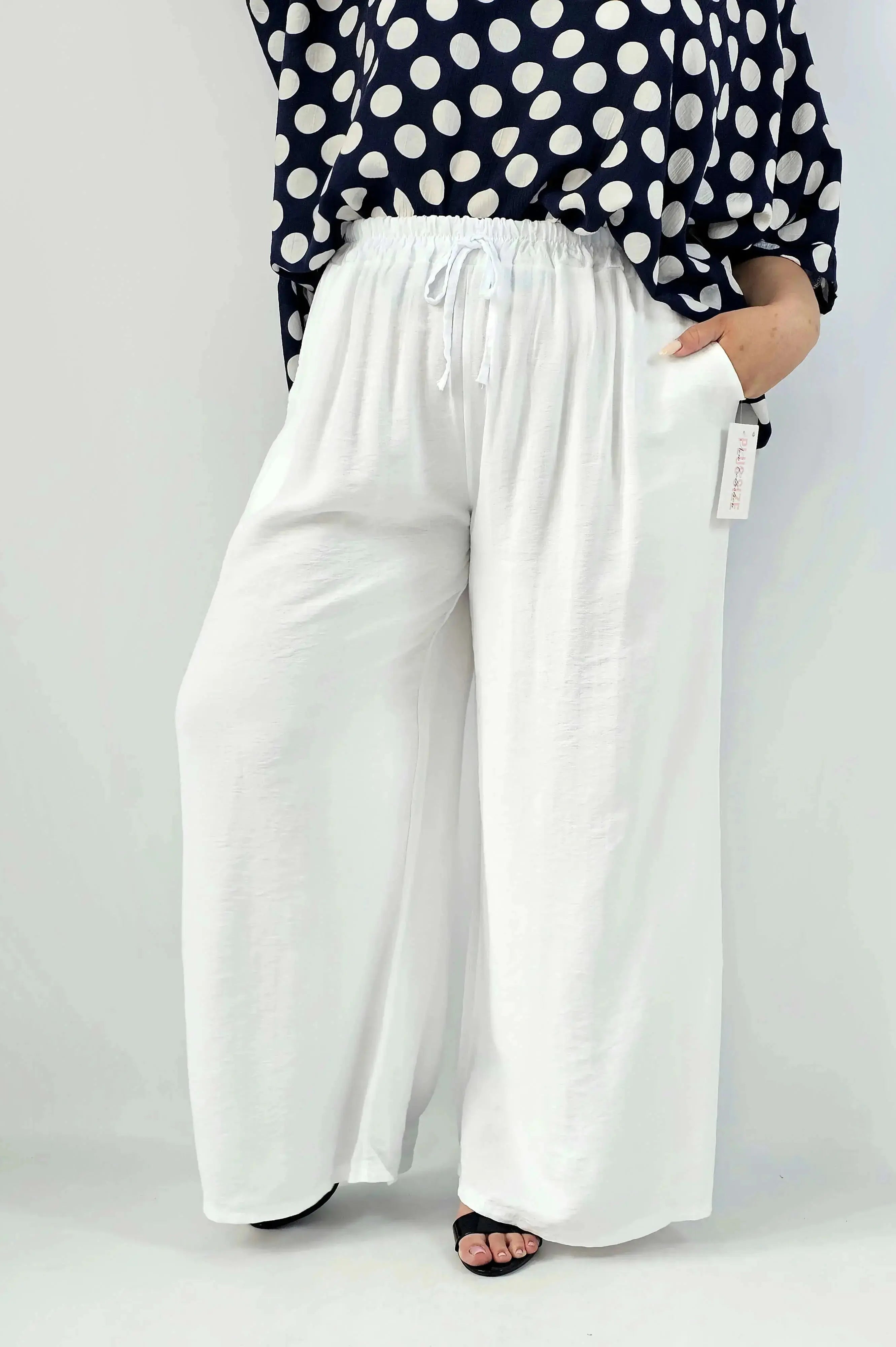 Spodnie wiskozowe plus size XXL – szerokie spodnie damskie z kieszeniami Stylowa XL