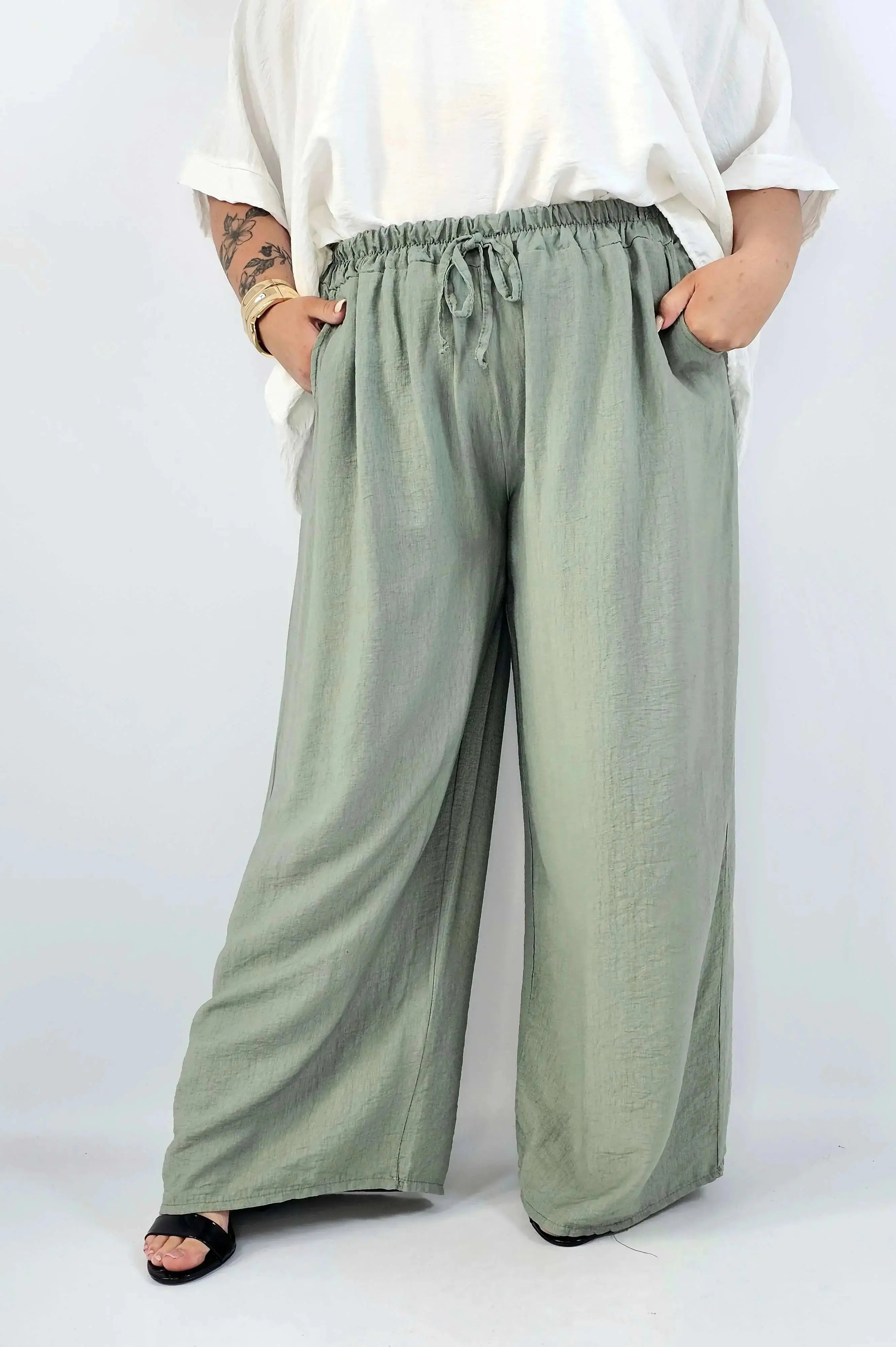 Spodnie wiskozowe plus size XXL – szerokie spodnie damskie z kieszeniami Stylowa XL