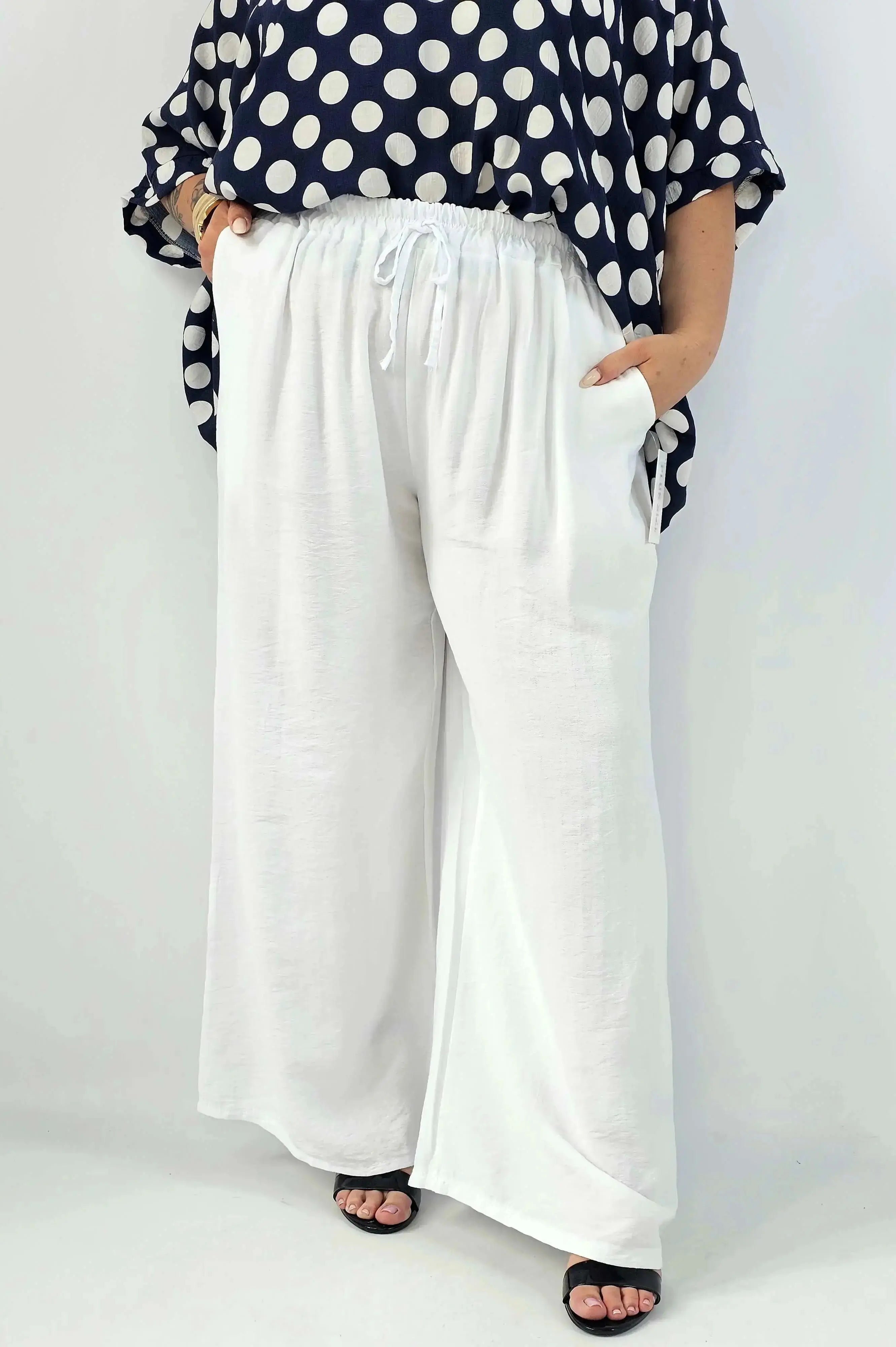 Spodnie wiskozowe plus size XXL – szerokie spodnie damskie z kieszeniami Stylowa XL