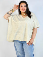Bluzka plus size sweterkowa ze złotym zdobieniem – elegancka i lekka Stylowa XL