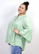 Bluzka plus size tunika z guzikami i falbankowym rękawem Stylowa XL