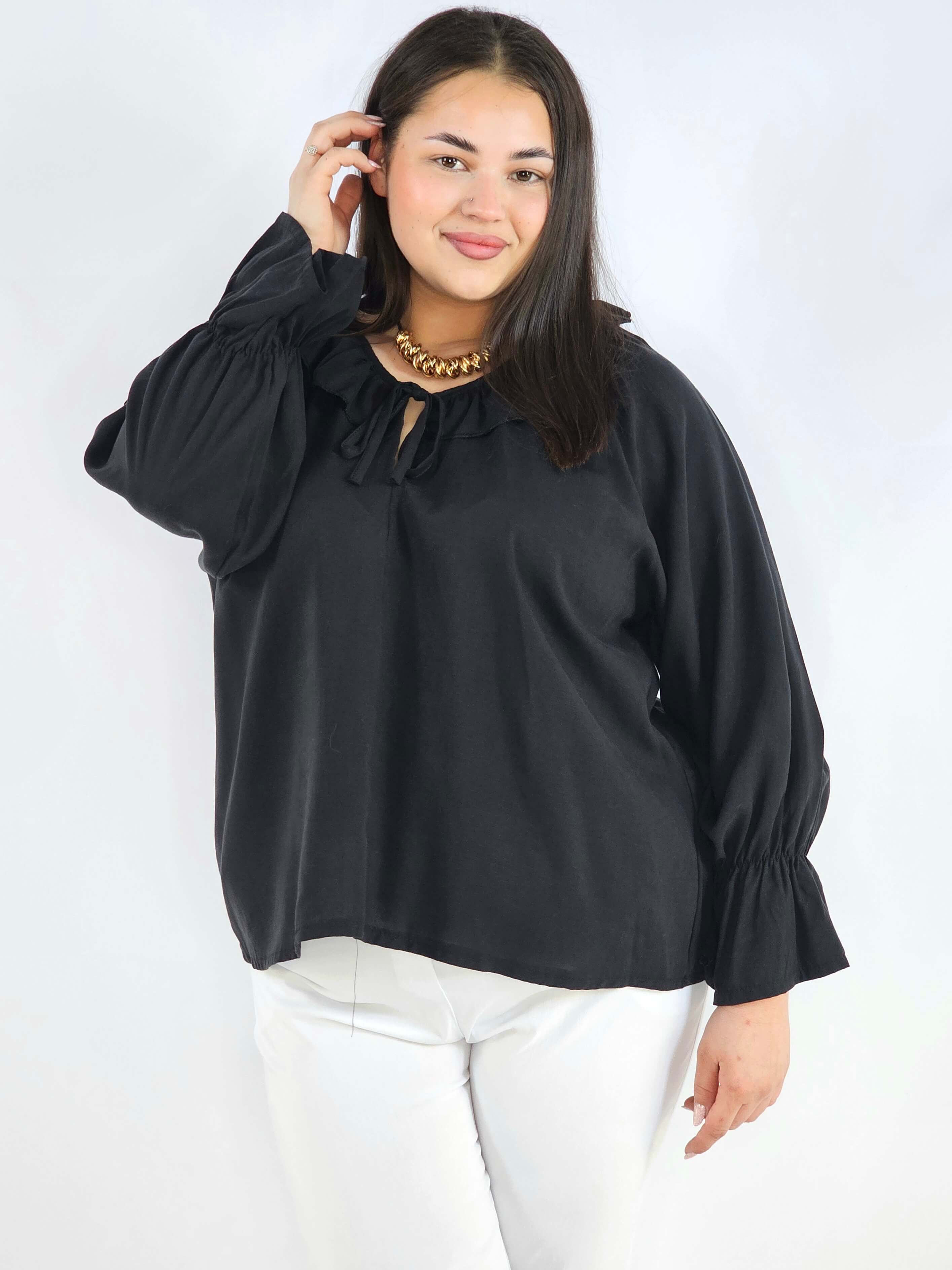 Bluzka plus size z falbaną – romantyczna elegancja w lekkim wydaniu Stylowa XL