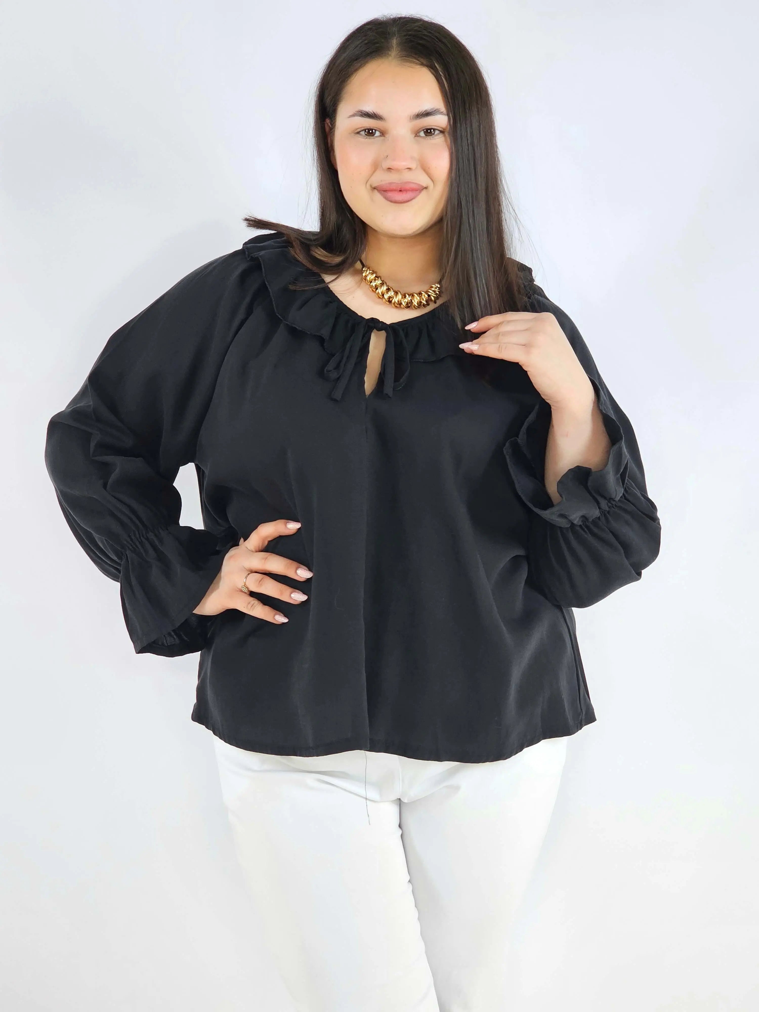 Bluzka plus size z falbaną – romantyczna elegancja w lekkim wydaniu Stylowa XL