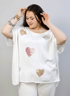 Bluzka sweterkowa plus size z sercami – luźna bluzka XXL z ozdobnym motywem Stylowa XL