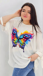 Bluzka z aplikacją na przodzie oraz wiązanym rękawem - kolorowy motyl Stylowa XL