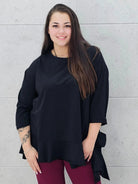 Czarna asymetryczna bluzka plus size z falbaną Stylowa XL
