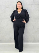 Czarny kombinezon plus size z kopertowym dekoltem i szerokimi nogawkami - Stylowa XL