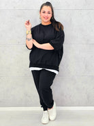 Dres plus size czarny – komfortowy komplet XXL dla kobiet ceniących styl i wygodę Stylowa XL