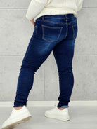 Granatowe jeansy plus size z guzikami – wygodne i modelujące Stylowa XL Stylowa XL