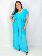Kombinezon plus size VIP z plisowanymi nogawkami i efektownym dekoltem Stylowa XL