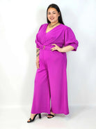 Kombinezon plus size z kopertowym dekoltem i paskiem – elegancki fason XXL Stylowa XL