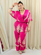 Kombinezon plus size z kopertowym dekoltem i szeroką nogawką – wyrazisty styl XXL Stylowa XL