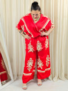Kombinezon plus size z kopertowym dekoltem i szeroką nogawką – wyrazisty styl XXL Stylowa XL