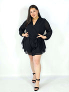 Kombinezon plus size z kopertowym dekoltem i wiązaniem – elegancka stylizacja XXL Stylowa XL