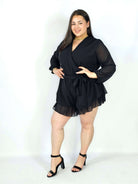 Kombinezon plus size z kopertowym dekoltem i wiązaniem – elegancka stylizacja XXL Stylowa XL