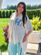 Koszula z efektem gniecenia i cekinowym napisem "Hi" - w kilku kolorach Stylowa XL