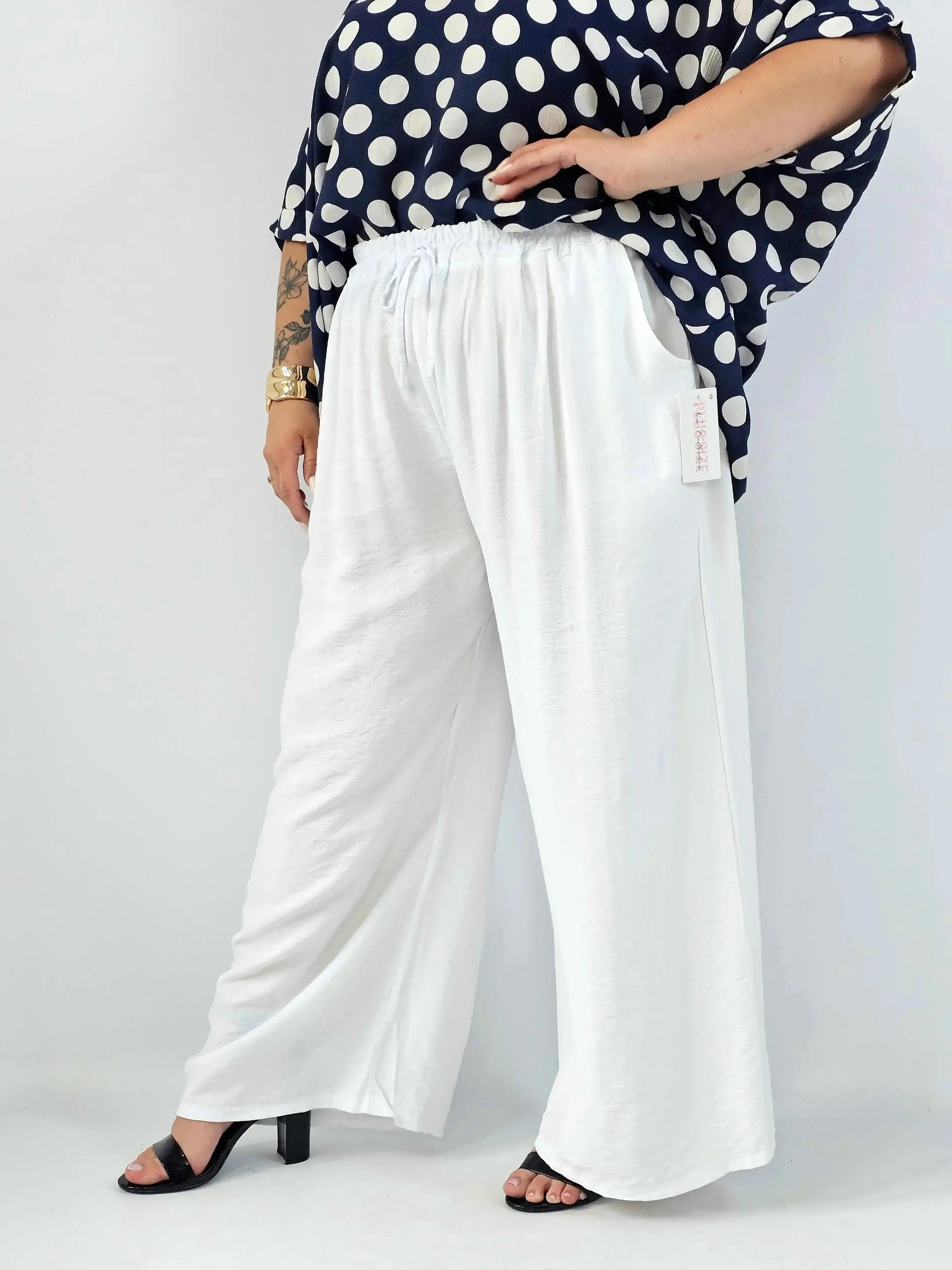 Spodnie wiskozowe plus size XXL – szerokie spodnie damskie z kieszeniami Stylowa XL