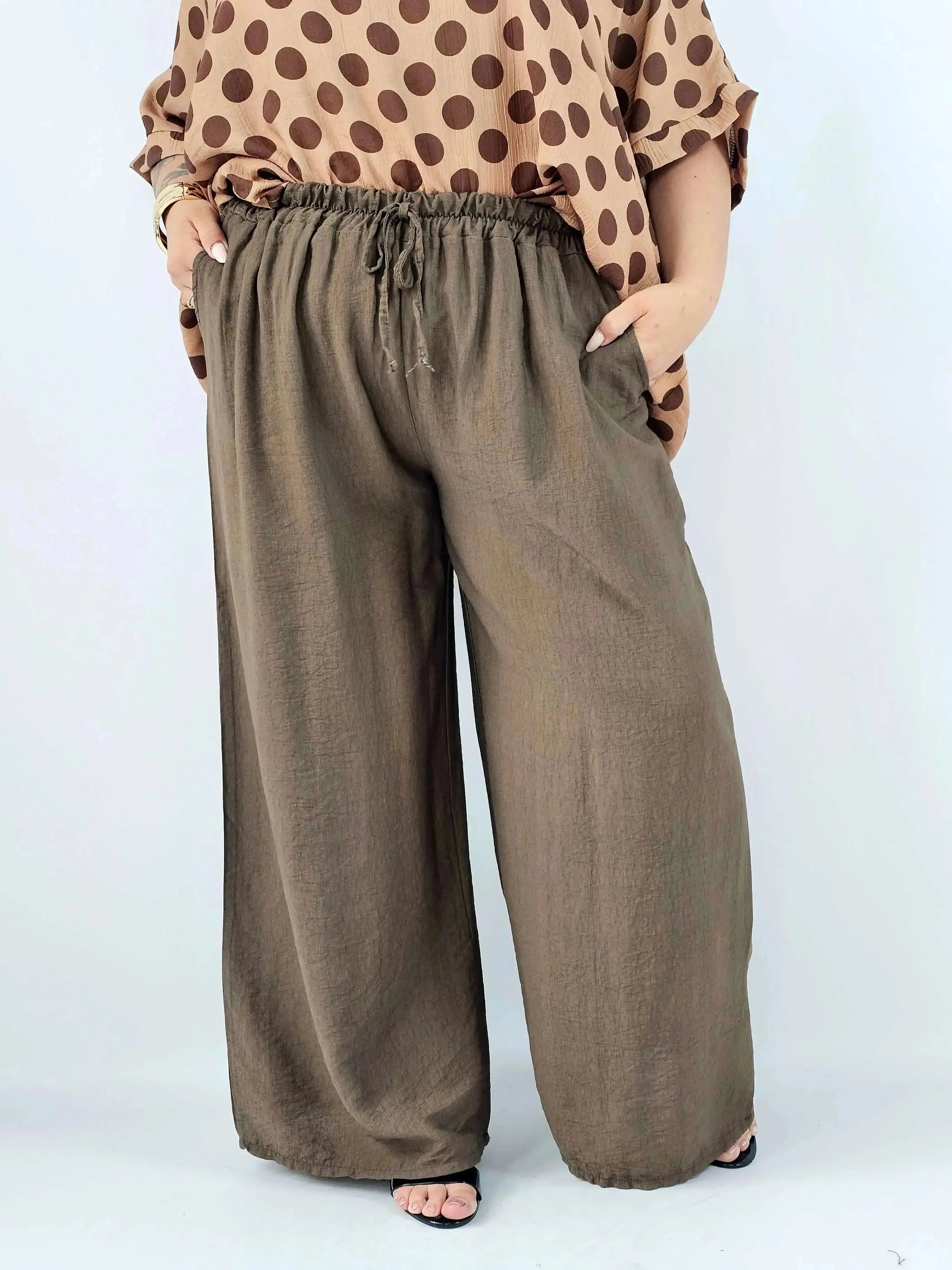 Spodnie wiskozowe plus size XXL – szerokie spodnie damskie z kieszeniami Stylowa XL