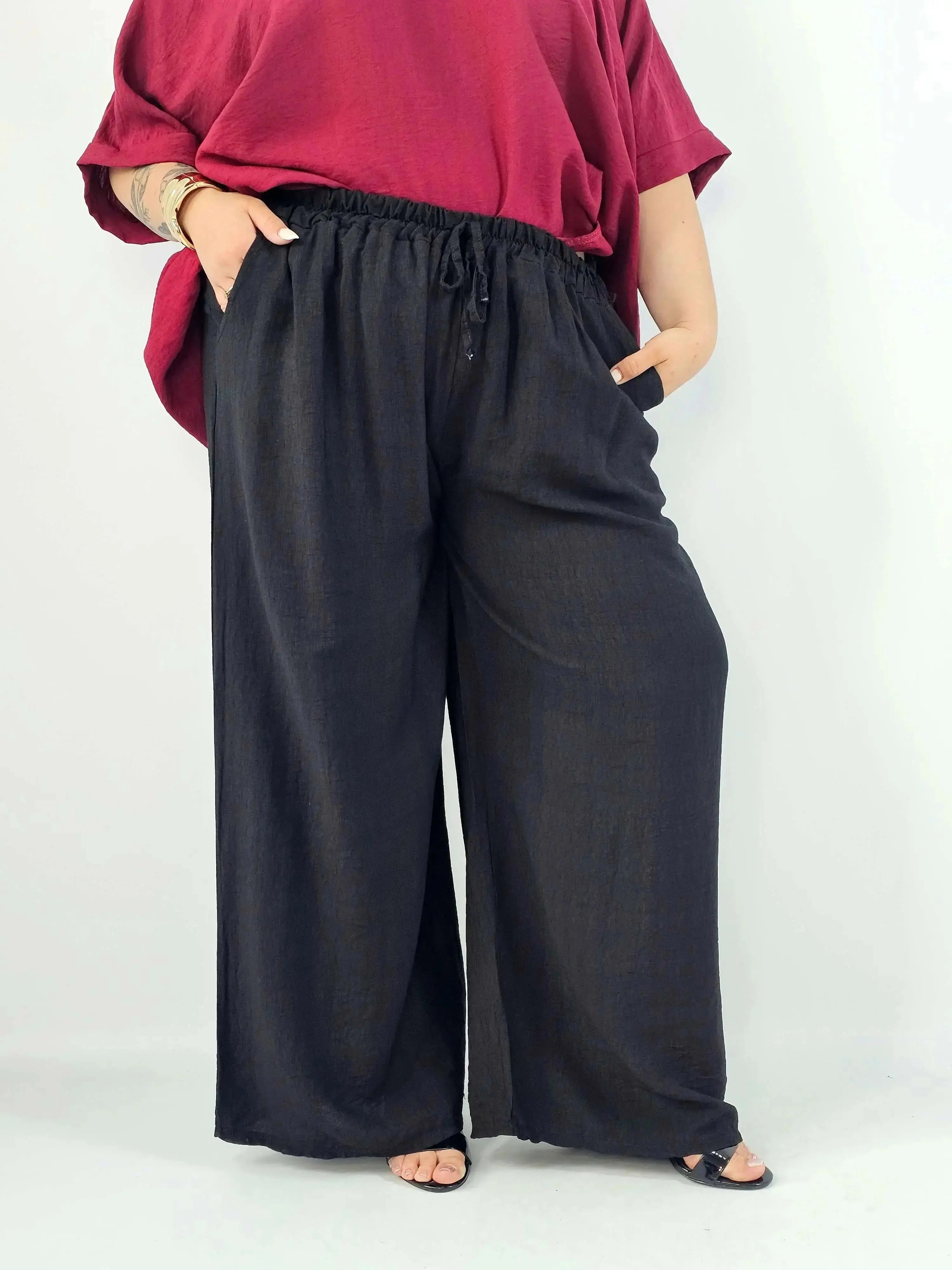 Spodnie wiskozowe plus size XXL – szerokie spodnie damskie z kieszeniami Stylowa XL