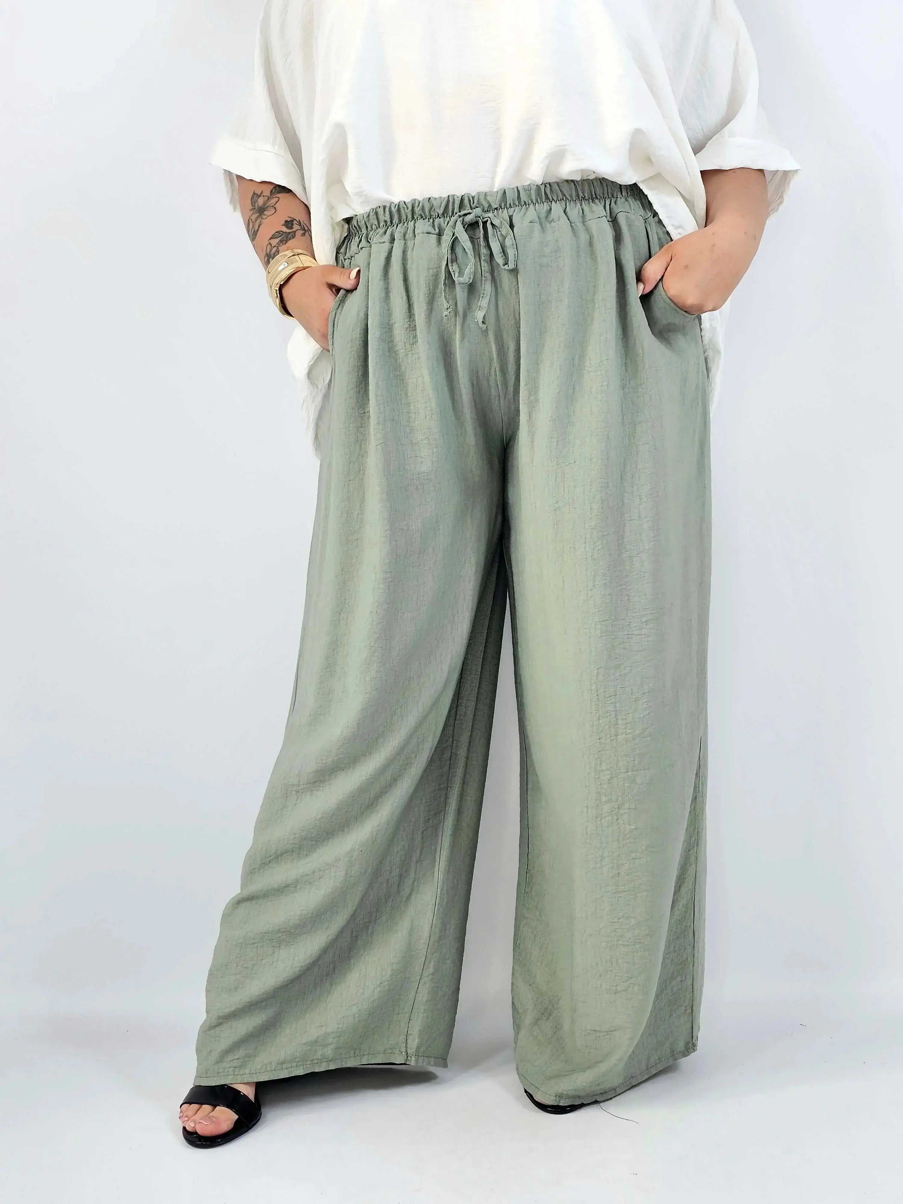 Spodnie wiskozowe plus size XXL – szerokie spodnie damskie z kieszeniami Stylowa XL
