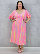 Sukienka midi plus size z głębokim dekoltem i kolorowym wzorem Stylowa XL