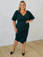Sukienka ołówkowa plus size z kopertowym dekoltem Stylowa XL
