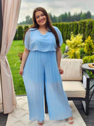 Zjawiskowy kombinezon z plisowanymi nogawkami – styl i wygoda w jednym! 🌸 Stylowa XL